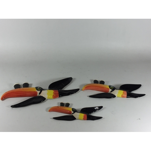 740 - A SET OF THREE CARLTON WARE GUINESS TOUCANS