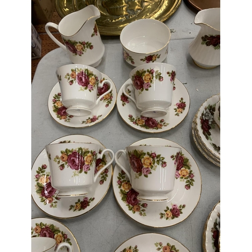 805 - A QUANTITY OF TEAWARE TO INCLUDE ROYAL IMPERIAL CUPS, SAUCERS AND CREAM JUG, PLUS COUNTRY ROSE STYLE... 