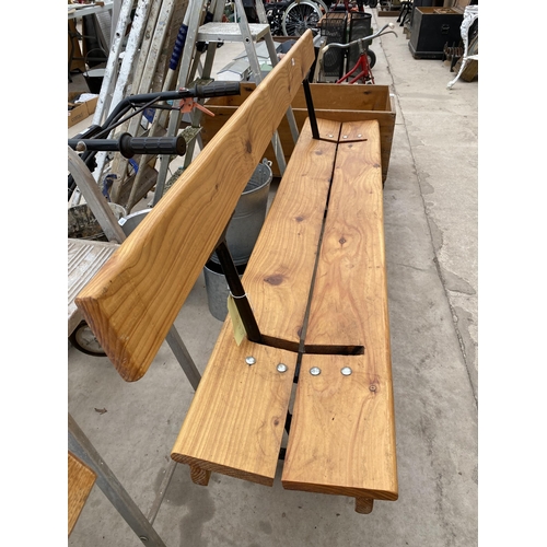 1650 - A LARGE WOODEN REVERSABLE RAILWAY BENCH WITH CAST LEGS