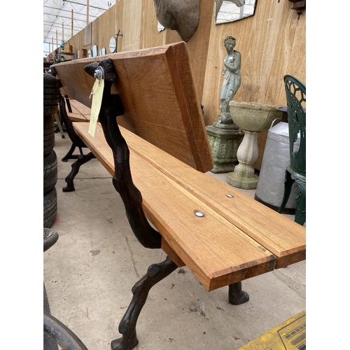 1651 - A LARGE REFURBISHED WOODEN SLATTED BENCH WITH 'KNOTTY' CAST IRON BENCH ENDS