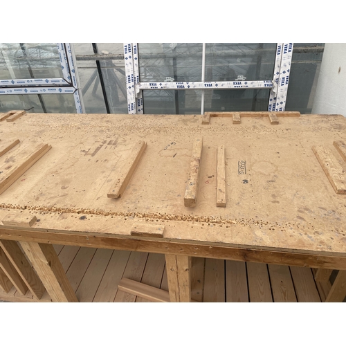 2307 - A LARGE WOODEN WORK BENCH