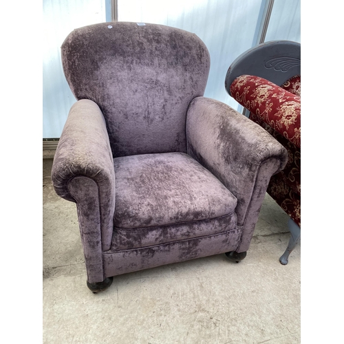 2542 - AN EDWARDIAN SPRUNG AND UPHOLSTERED EASY CHAIR ON BUN FEET