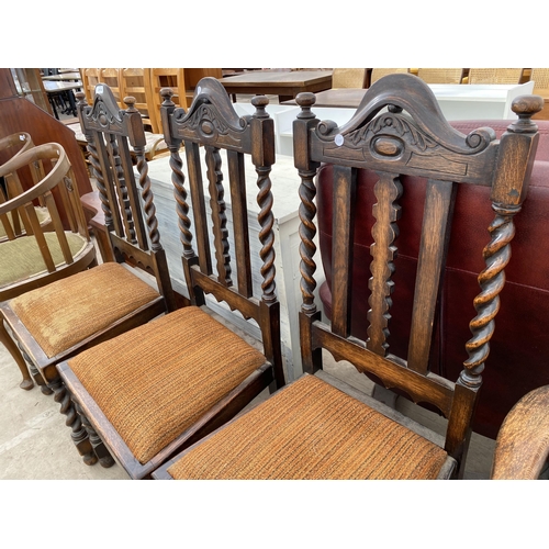 2574 - FOUR EARLY 20TH CENTURY OAK JACOBEAN STYLE DINING CHAIRS ON BARLEYTWIST LEGS AND UPRIGHTS, ONE BEING... 