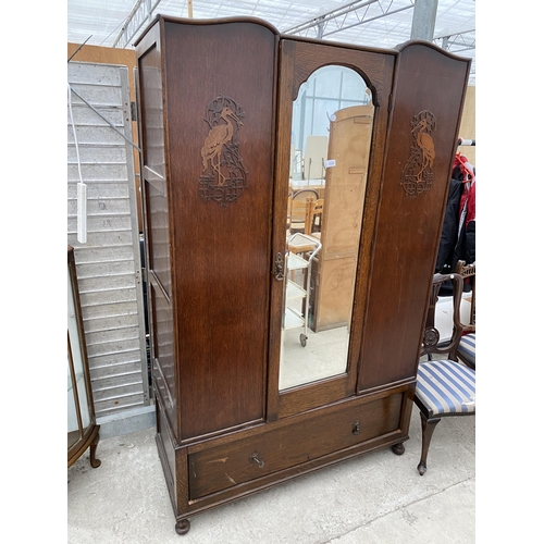 2828 - AN EARLY 20TH CENTURY OAK MIRROR-DOOR WARDROBE WITH DRAWER TO THE BASE AND APPLIED FLAMINGO DECORATI... 