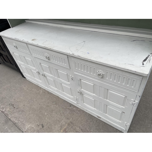 2945 - A MODERN WHITE PAINTED DRESSER WITH GLAZED AND LEADED DOORS TO UPPER PORTION, 60