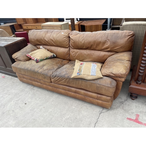 2950 - A DISTRESSED LEATHER TWO SEATER SOFA