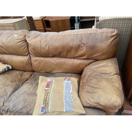 2950 - A DISTRESSED LEATHER TWO SEATER SOFA