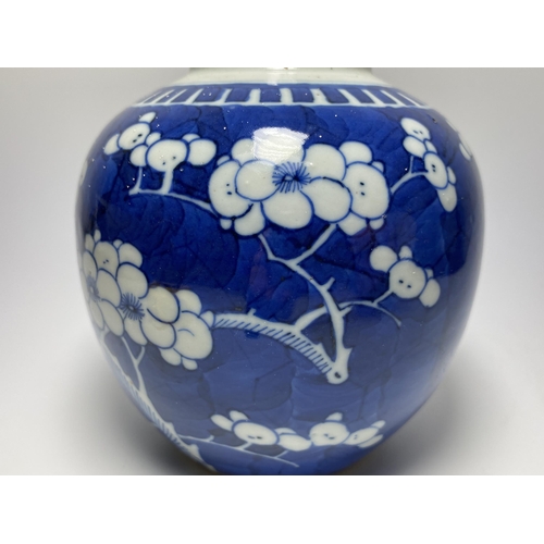 303 - AN EARLY 20TH CENTURY CHINESE BLUE AND WHITE PRUNUS PATTERN GINGER JAR, DOUBLE RING MARK TO BASE, HE... 