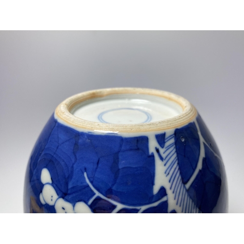 303 - AN EARLY 20TH CENTURY CHINESE BLUE AND WHITE PRUNUS PATTERN GINGER JAR, DOUBLE RING MARK TO BASE, HE... 