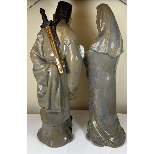 313 - A LARGE PAIR OF CHINESE STONEWARE POTTERY IMMORTALS FIGURES - SCHOLAR IN ROBE AND GEISHA LADY, HEIGH... 