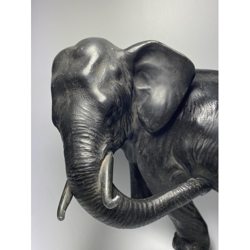 314 - AN EARLY 20TH CENTURY JAPANESE METAL MODEL OF AN ELEPHANT, 20 X 27CM