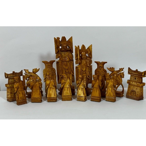 322 - AN ORIENTAL STAINED BONE CHESS SET (ONE PAWN MISSING)