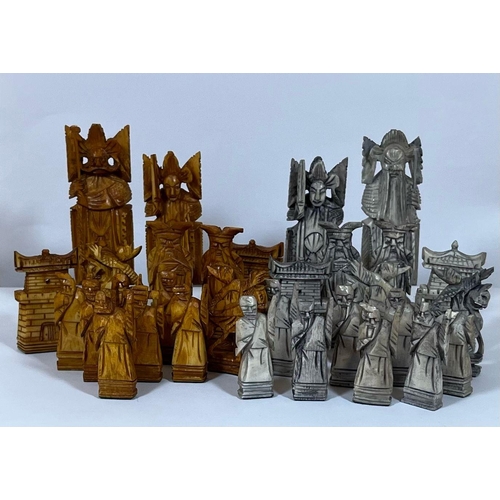 322 - AN ORIENTAL STAINED BONE CHESS SET (ONE PAWN MISSING)