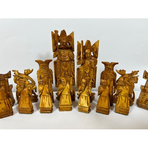 322 - AN ORIENTAL STAINED BONE CHESS SET (ONE PAWN MISSING)