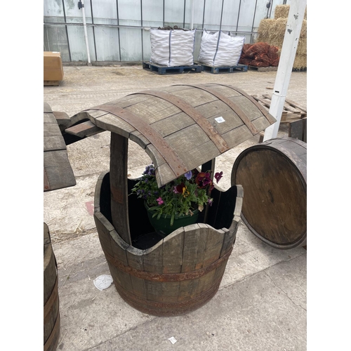 103 - A WISHING WELL MADE FROM OAK BARRELS WITH A HANGING BASKET HOOK NO VAT