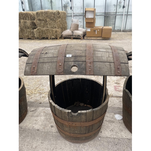 104 - A WISHING WELL MADE FROM OAK BARRELS WITH A HANGING BASKET HOOK NO VAT