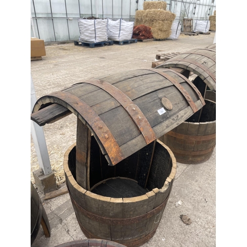 105 - A WISHING WELL MADE FROM OAK BARRELS WITH A HANGING BASKET HOOK NO VAT