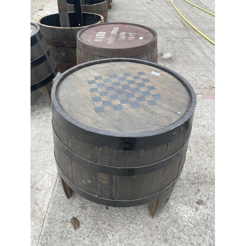 127 - A TABLE MADE FROM AN OAK BARREL MARKED WITH A CHESS/DRAUGHT BOARD - NO VAT