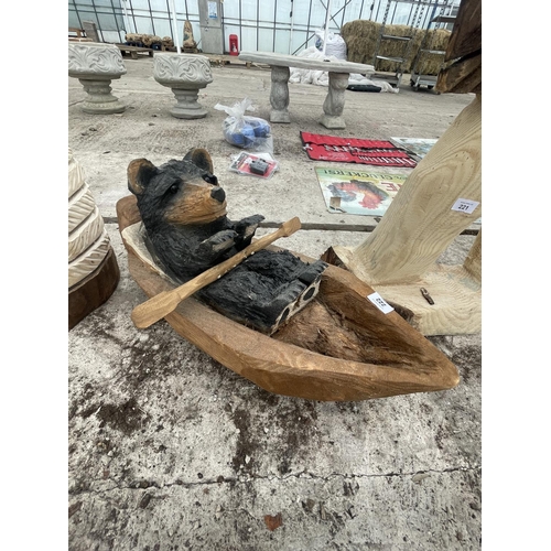 222 - A WOOD CARVING OF A BEAR IN A ROWING BOAT LENGTH APPROXIMATELY 60 CM NO VAT