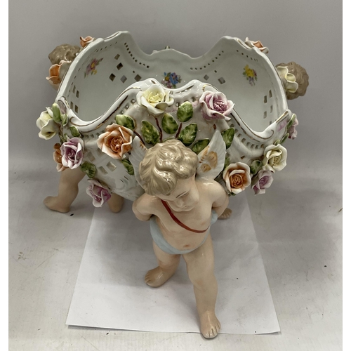 31 - A CONTINENTAL PORCELAIN CHERUB DESIGN FLORAL ENCRUSTED BOWL WITH MEISSEN BLUE CROSS SWORDS MARK TO B... 