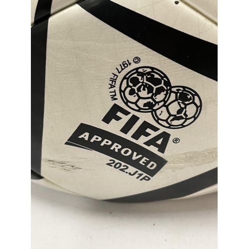 83 - A SIGNED ADIDAS FIFA ATHENS 2004 FOOTBALL