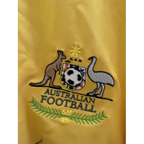 87 - A SIGNED AUSTRALIAN FOOTBALL SHIRT SIGNED BY MARK BRESCIANO