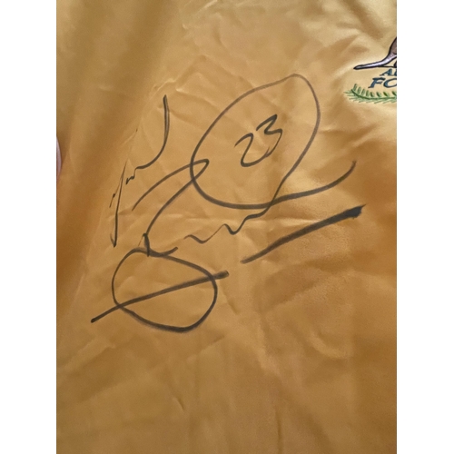 87 - A SIGNED AUSTRALIAN FOOTBALL SHIRT SIGNED BY MARK BRESCIANO