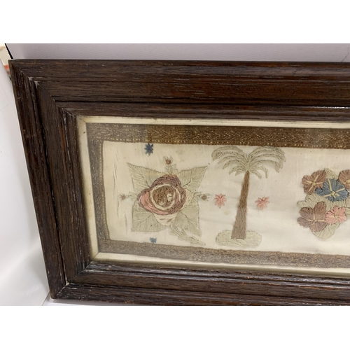 72 - A VINTAGE WOODEN FRAMED EMBROIDERY WITH CROWN DESIGN