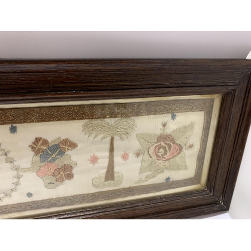 72 - A VINTAGE WOODEN FRAMED EMBROIDERY WITH CROWN DESIGN