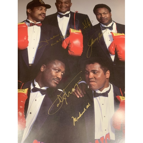 96 - A SIGNED AND FRAMED PHOTOGRAPH OF MUHAMMED ALI , GEORGE FOREMAN, JOE FRAZIER, KEN NORTON & LARRY HOL... 