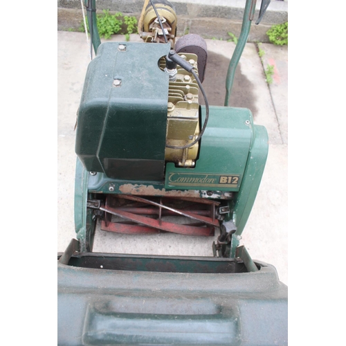 32 - A PETROL CYLINDER COMMORE B12 ATCO LAWNMOWER COMPLETE WITH GRASS BOX AND MANUAL BELIEVED IN WORKING ... 