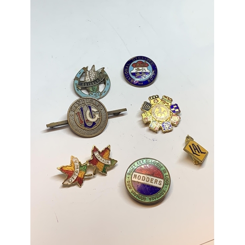 697 - SEVEN VARIOUS VINTAGE ENAMEL BADGES