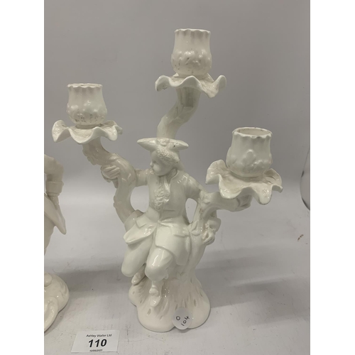 110 - TWO PIECES OF CREAMWARE, ONE A CANDLESTICK, THE OTHER A SPILL HOLDER, BOTH WITH FIGURINES