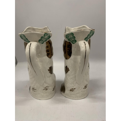 113 - A PAIR OF VINTAGE STAFFORDSHIRE DOG JUGS, HEIGHT 25CM