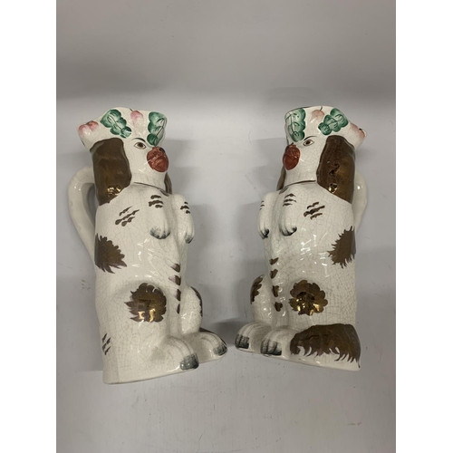 113 - A PAIR OF VINTAGE STAFFORDSHIRE DOG JUGS, HEIGHT 25CM