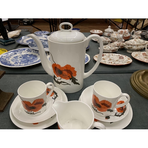 115 - A WEDGWOOD COFFEE SET IN THE SUSIE COOPER POPPY DESIGN TO INCLUDE A COFFEE POT, CREAM JUG, SUGAR BOW... 