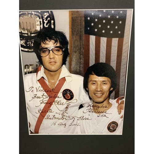 122 - A PERSONAL PHOTO BELONGING TO ELVIS PRESLEY SIGNED BY KANG RHEE, MARTIAL ARTS TRAINER