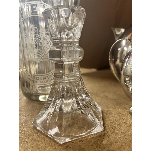 1091 - A VINTAGE SCHWEPPES SODA WATER BOTTLE PLUS A GLASS CANDLESTICK