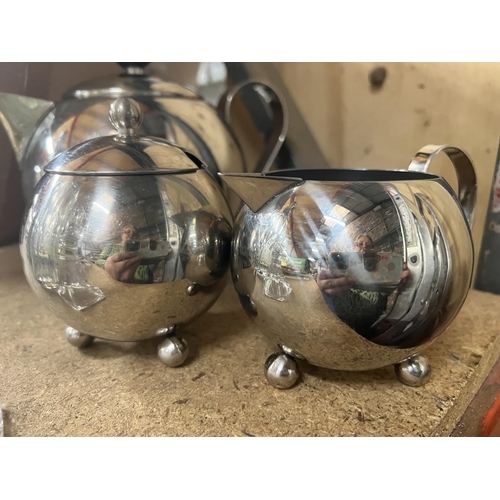 1092 - A SILVER PLATED TEAPOT, SUGAR BOWL AND CREAM JUG