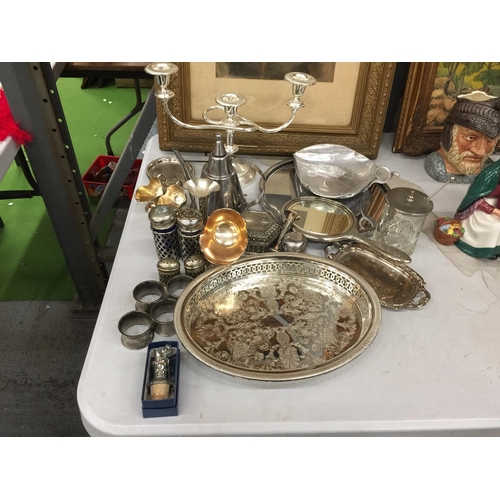 1192 - A LARGE QUANTITY OF SILVER PLATED ITEMS TO INCLUDE A CANDLEABRA, CRUETS, TRAYS, A HAND MIRROR, NAPKI... 