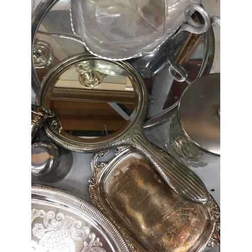 1192 - A LARGE QUANTITY OF SILVER PLATED ITEMS TO INCLUDE A CANDLEABRA, CRUETS, TRAYS, A HAND MIRROR, NAPKI... 