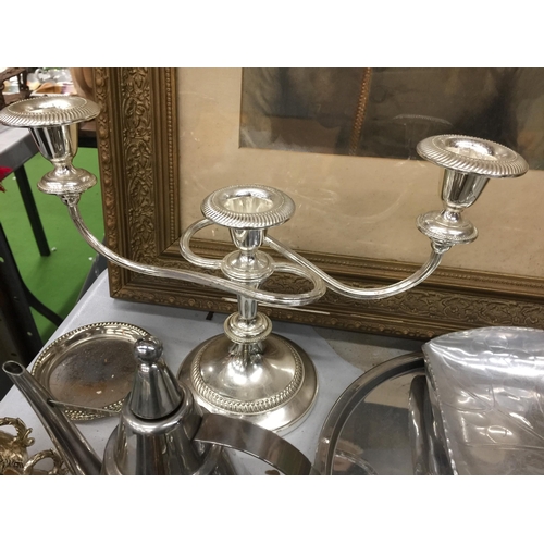 1192 - A LARGE QUANTITY OF SILVER PLATED ITEMS TO INCLUDE A CANDLEABRA, CRUETS, TRAYS, A HAND MIRROR, NAPKI... 