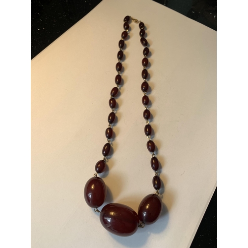 701 - A CHERRY AMBER NECKLACE