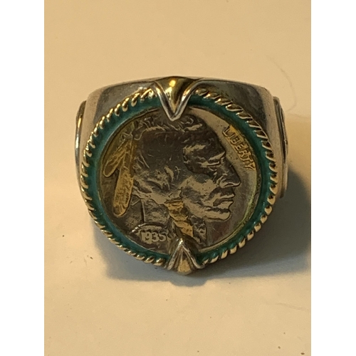 703 - A LARGE RING WITH A FIVE CENT COIN ENGRAVED 'INDIAN HEAD NICKEL HONOURING THE AMERICAN WEST'