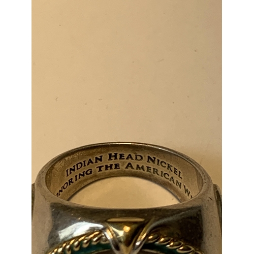 703 - A LARGE RING WITH A FIVE CENT COIN ENGRAVED 'INDIAN HEAD NICKEL HONOURING THE AMERICAN WEST'