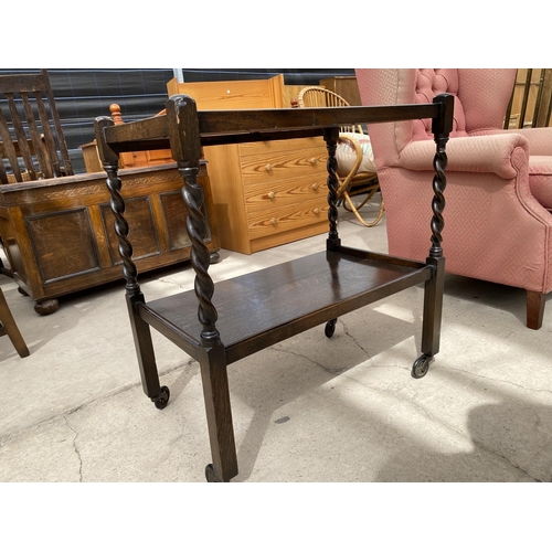 2956 - AN EARLY 20TH CENTURY OAK BARLEYTWIST TWO TIER TROLLEY