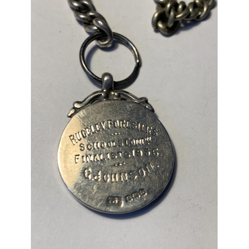 526 - A POCKET WATCH ON A CHAIN WITH A HALLMARKED BIRMINGHAM SILVER FOB