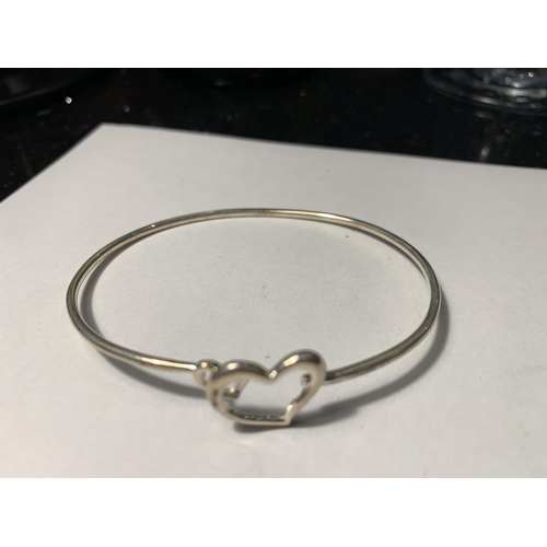 539 - THREE SILVER BANGLES