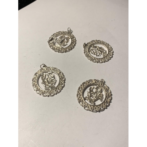 549 - FOUR SILVER PENDANTS