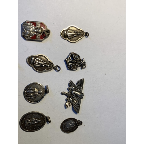 560 - FOURTEEN VARIOUS RELIGIOUS PENDANTS